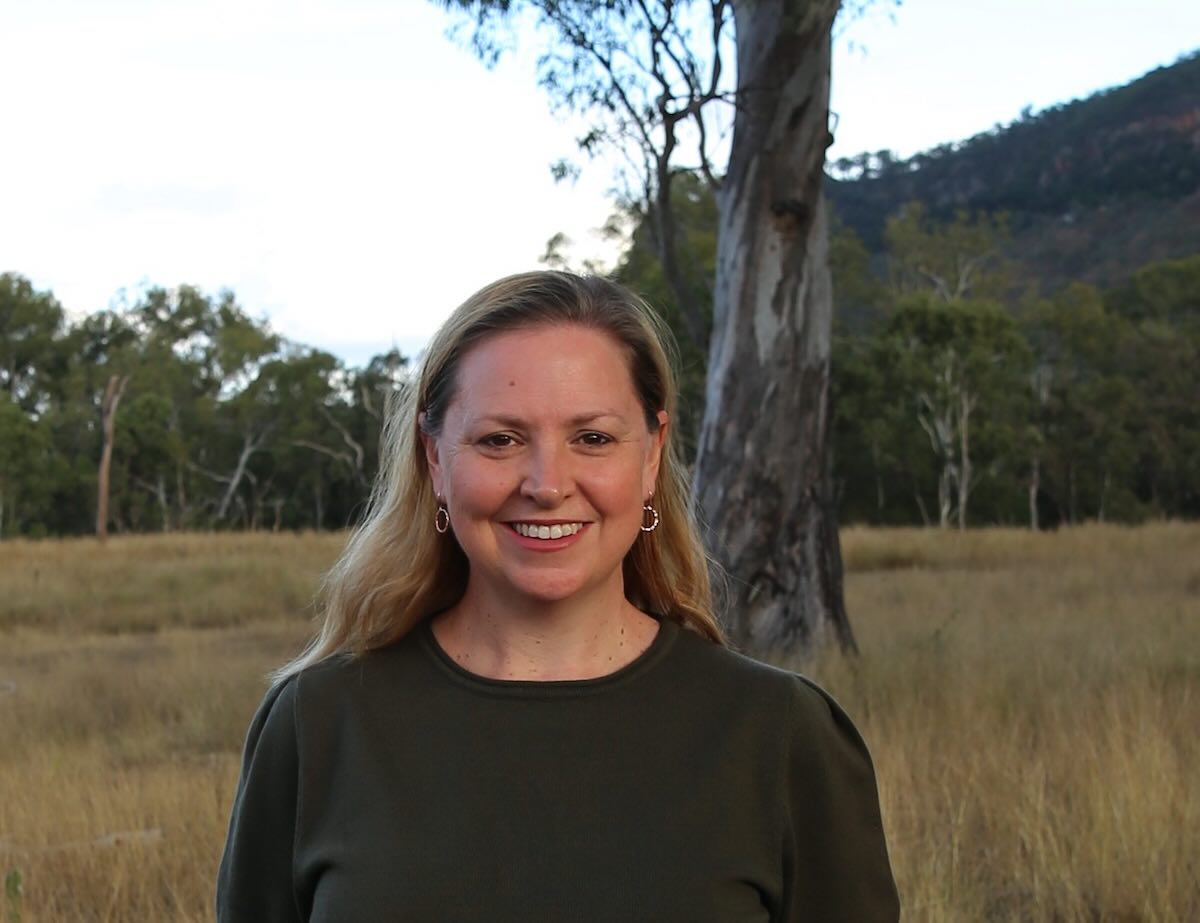 Photo of Zhan Patterson, founder of People Planet Purpose, standing on a Southeast Queensland property
